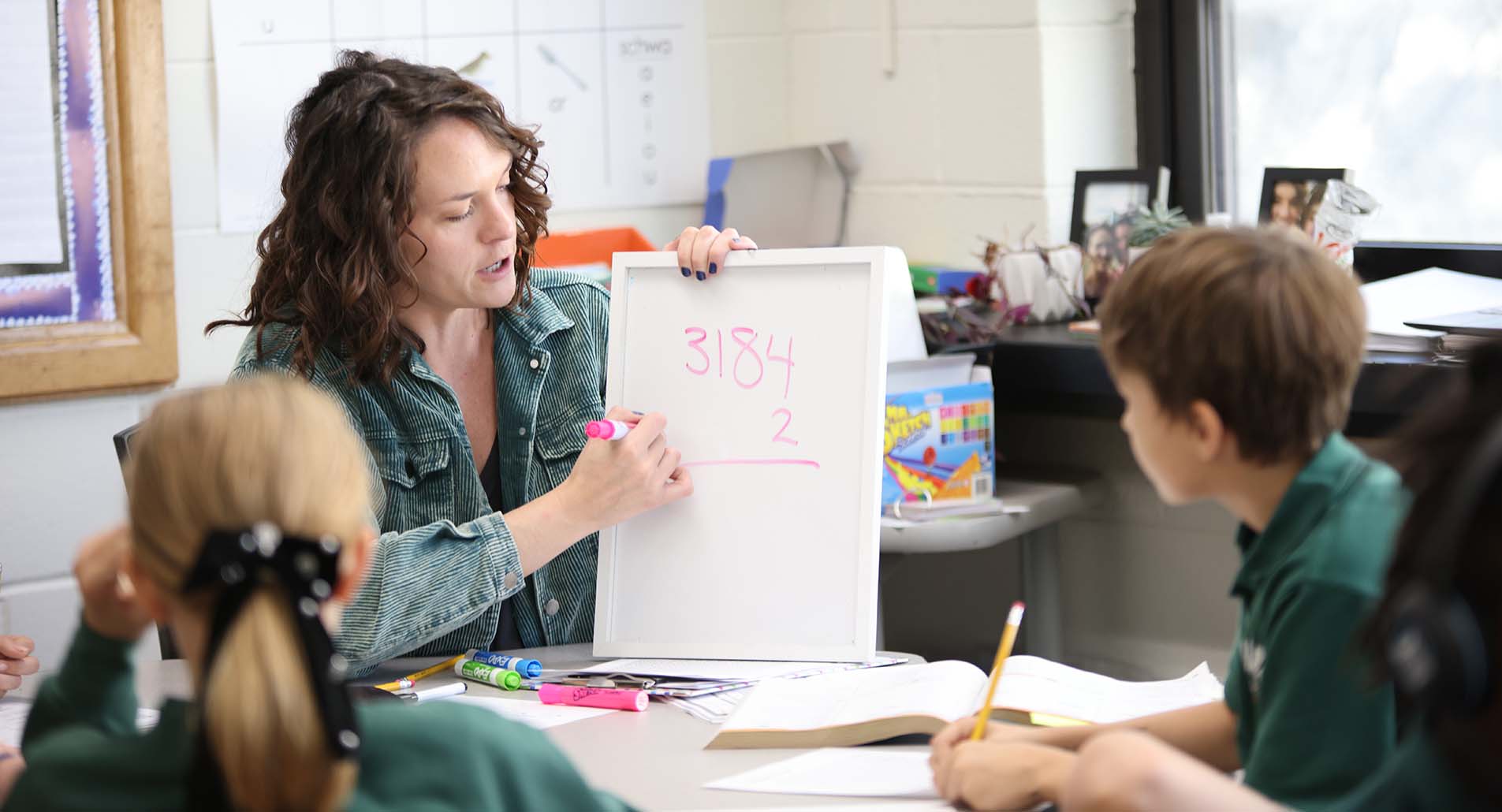 Teacher helping student